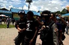 West Papuan journalist John Kuayo arrested by Indonesian police for wearing a “Free West Papua” t-shirt
